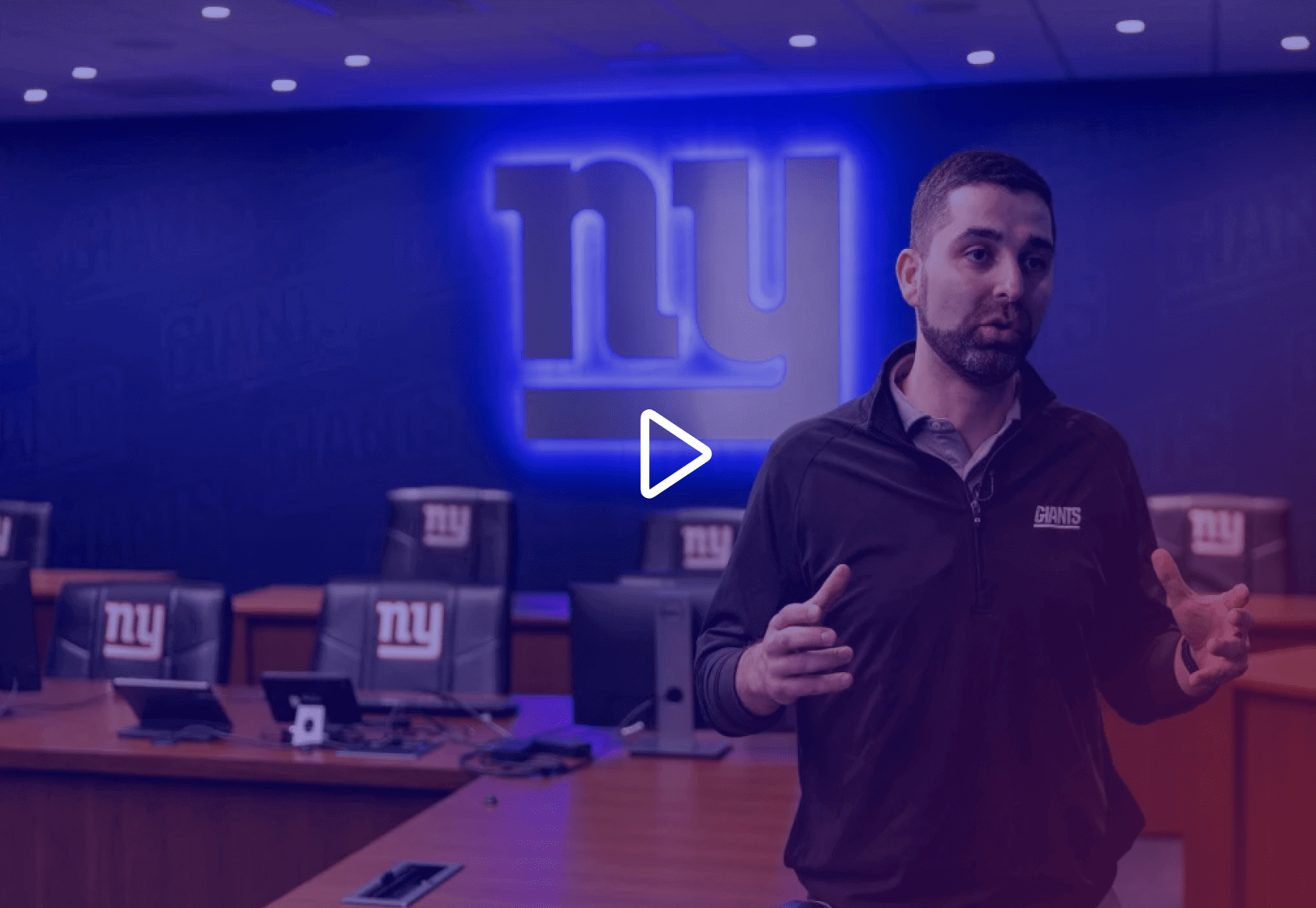 Man standing in the draft room explaing the technology